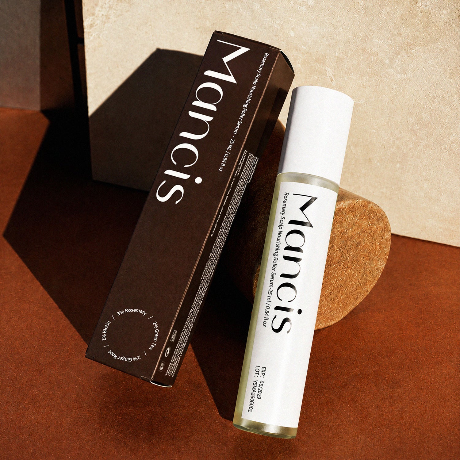 Rosemary Leave-In Scalp Roller Serum bottle beside its black product box